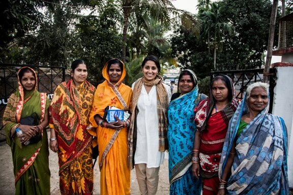 Anupama standing with the women she met at the Church’s Auxiliary for Social Action (CASA)