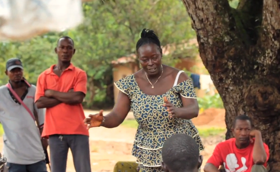Susan Matthews educating her community in Boroma Village in Sierra Leone about schistosomiasis