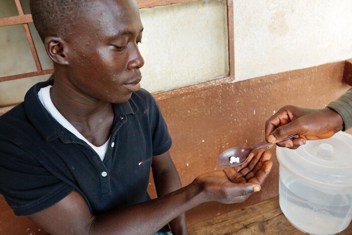 A man receives medications to prevent neglected tropical diseases